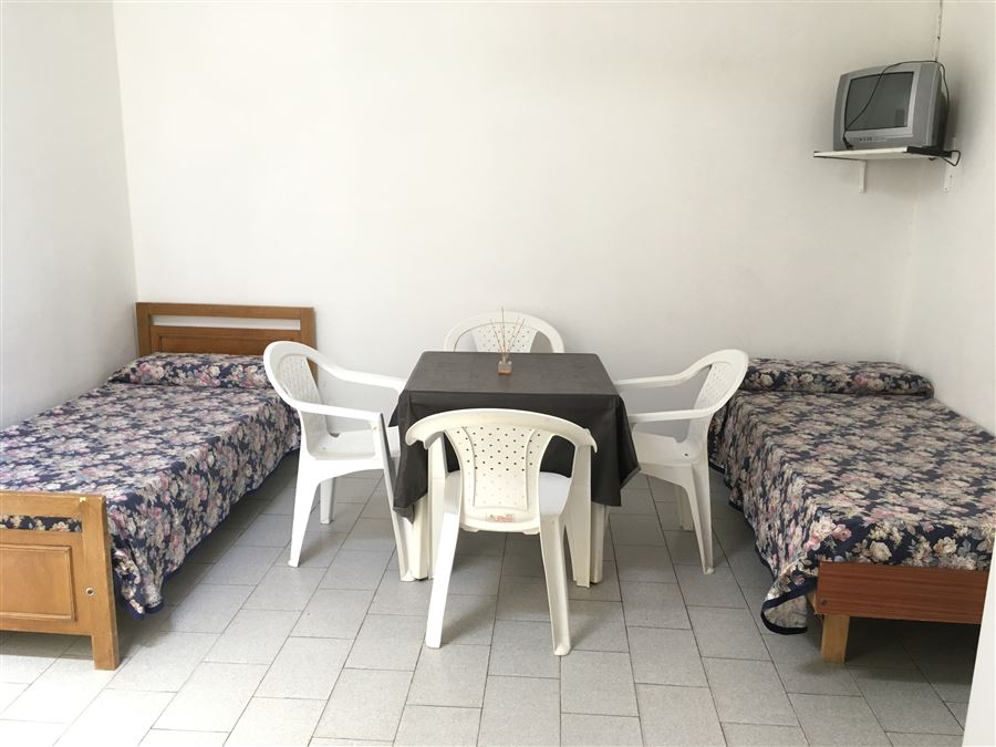 Comedor y camas de los departamentos | Recreo Serrano Departamentos y Habitaciones - Villa Cura Brochero - Traslasierra