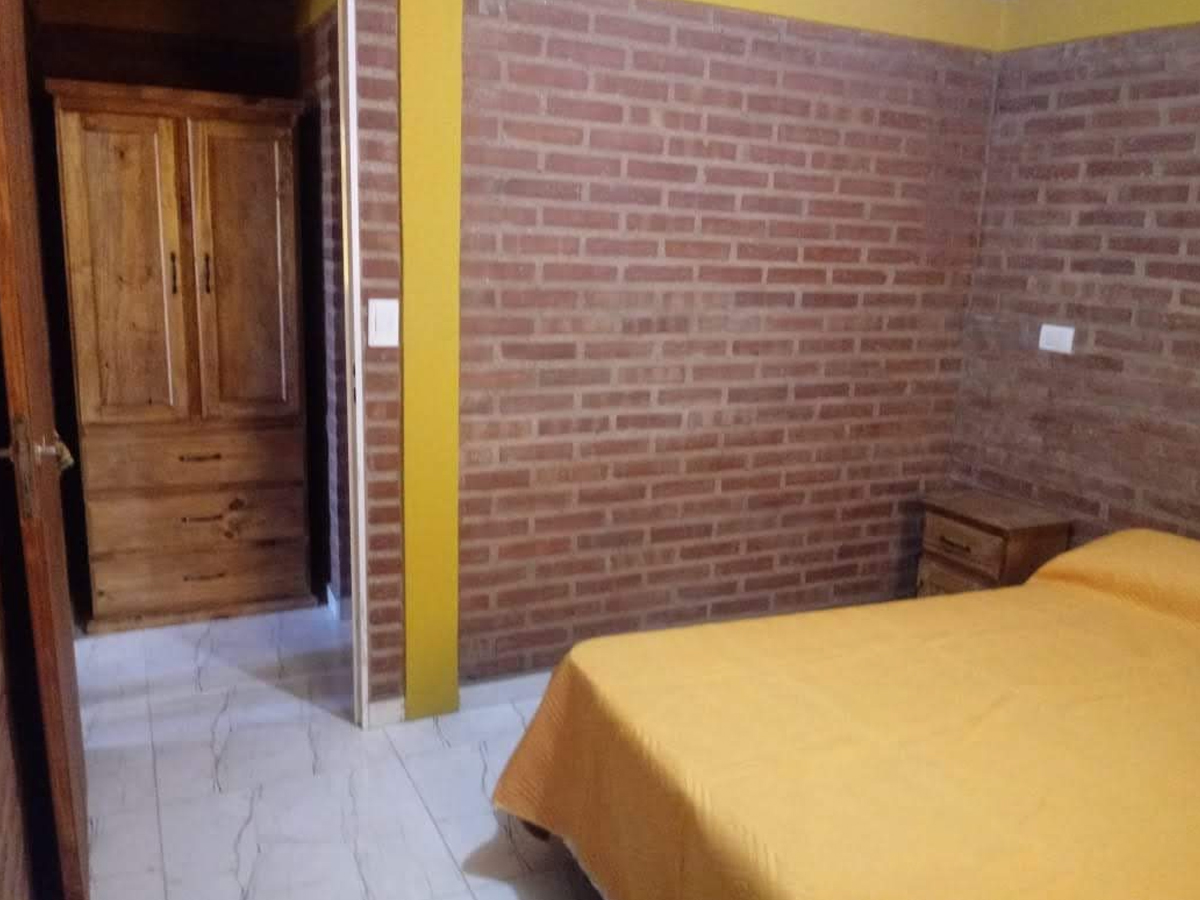 Habitación matrimonial departamentos 1 dormitorio | La Bendición Cabañas - Villa Cura Brochero - Traslasierra