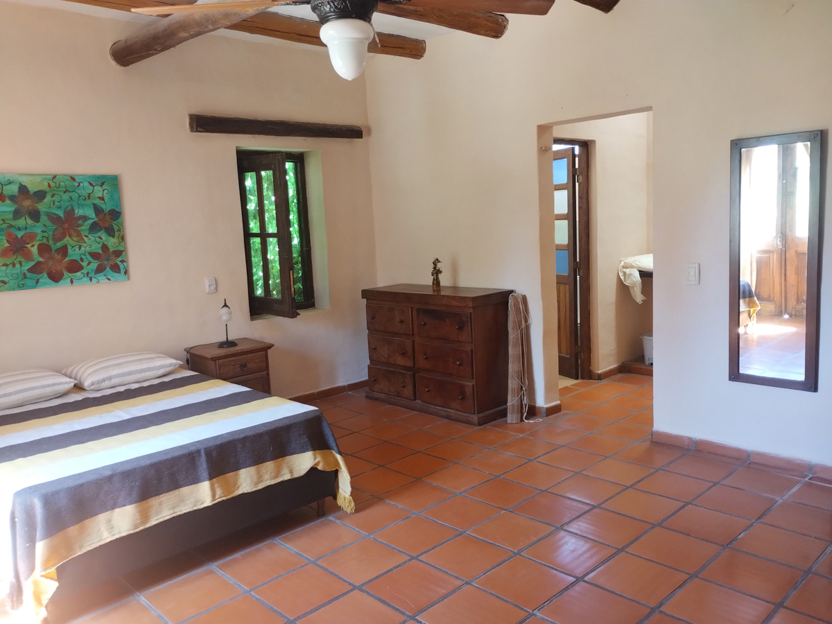 Dormitorio en suite | Sobre la Playa I Casa de Campo - Mina Clavero - Traslasierra